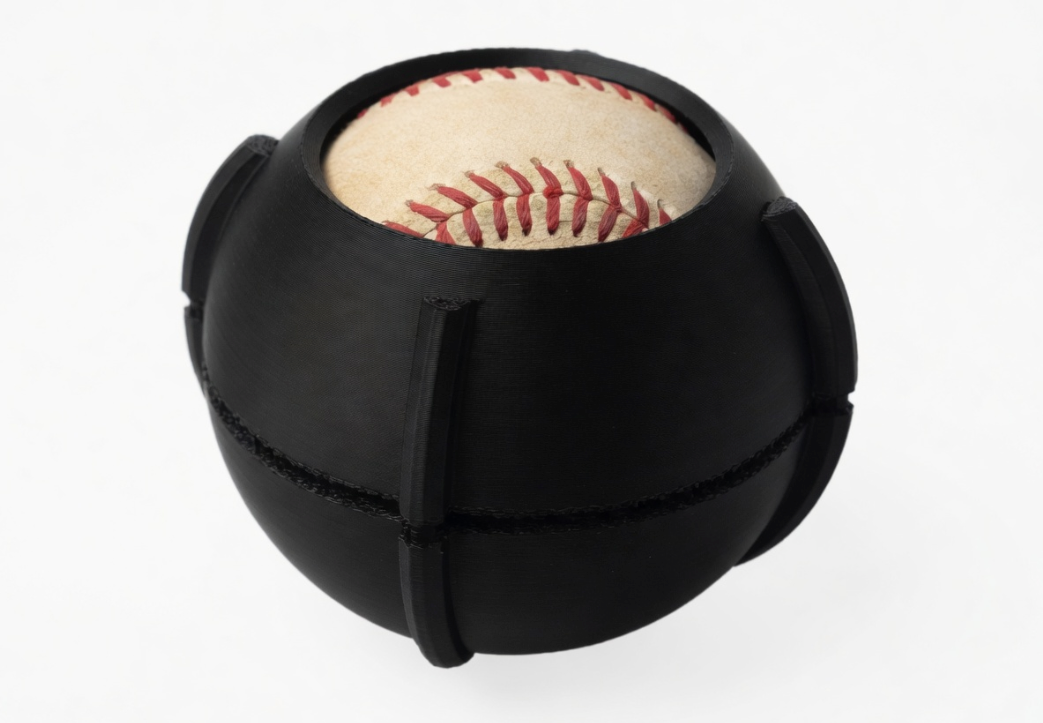 Spin Coach training tool around a baseball